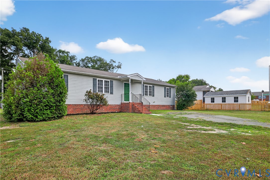 1827 Clarkson Road Richmond, VA 23224 - Photo 2 of 24 a view of a house with a yard and a porch
