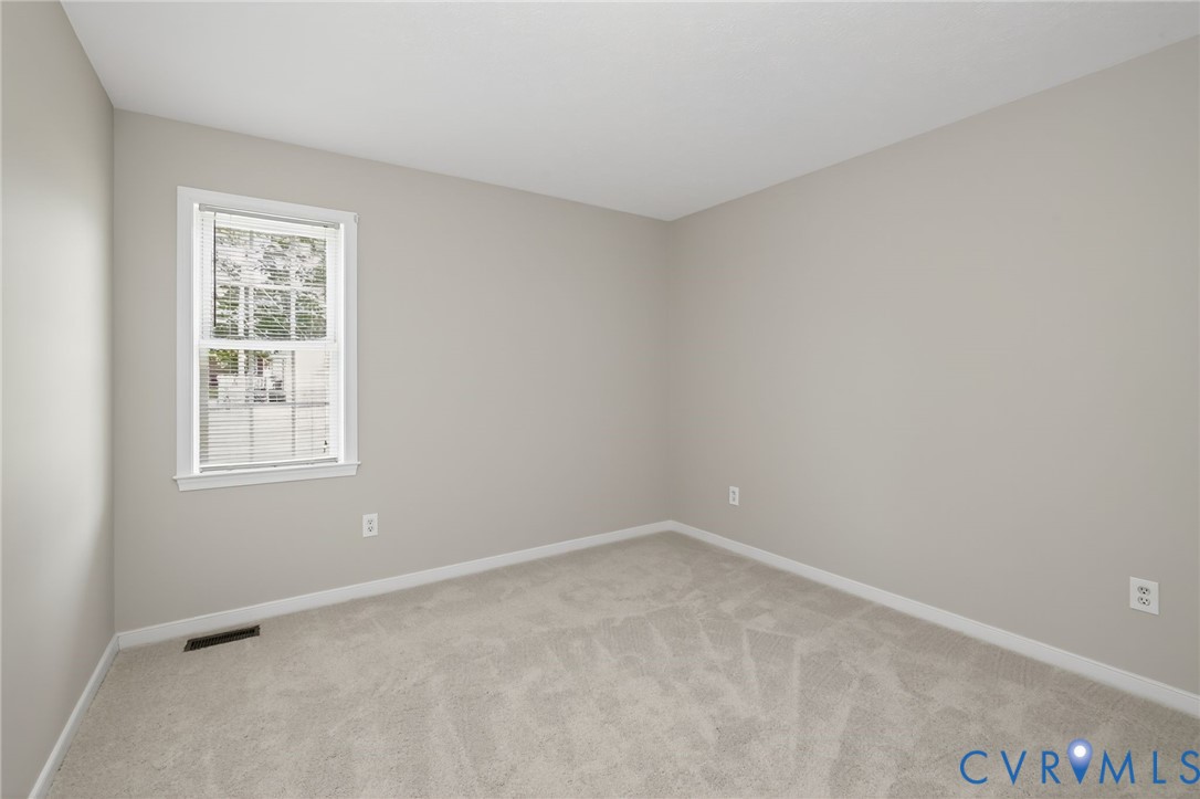 1827 Clarkson Road Richmond, VA 23224 - Photo 6 of 24 an empty room with a window