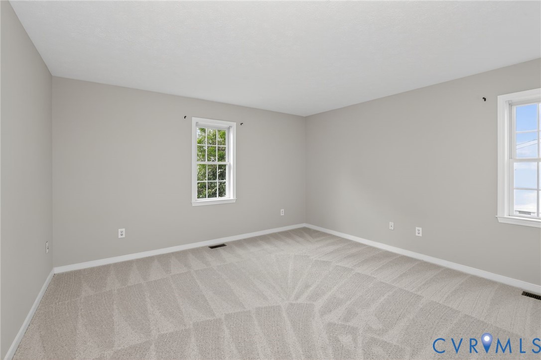 1827 Clarkson Road Richmond, VA 23224 - Photo 8 of 24 a view of an empty room with a window