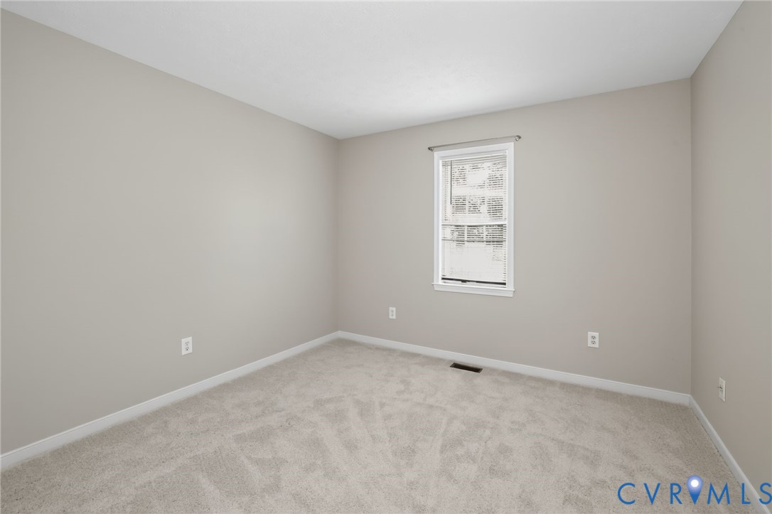 1827 Clarkson Road Richmond, VA 23224 - Photo 9 of 24 a view of an empty room with a window