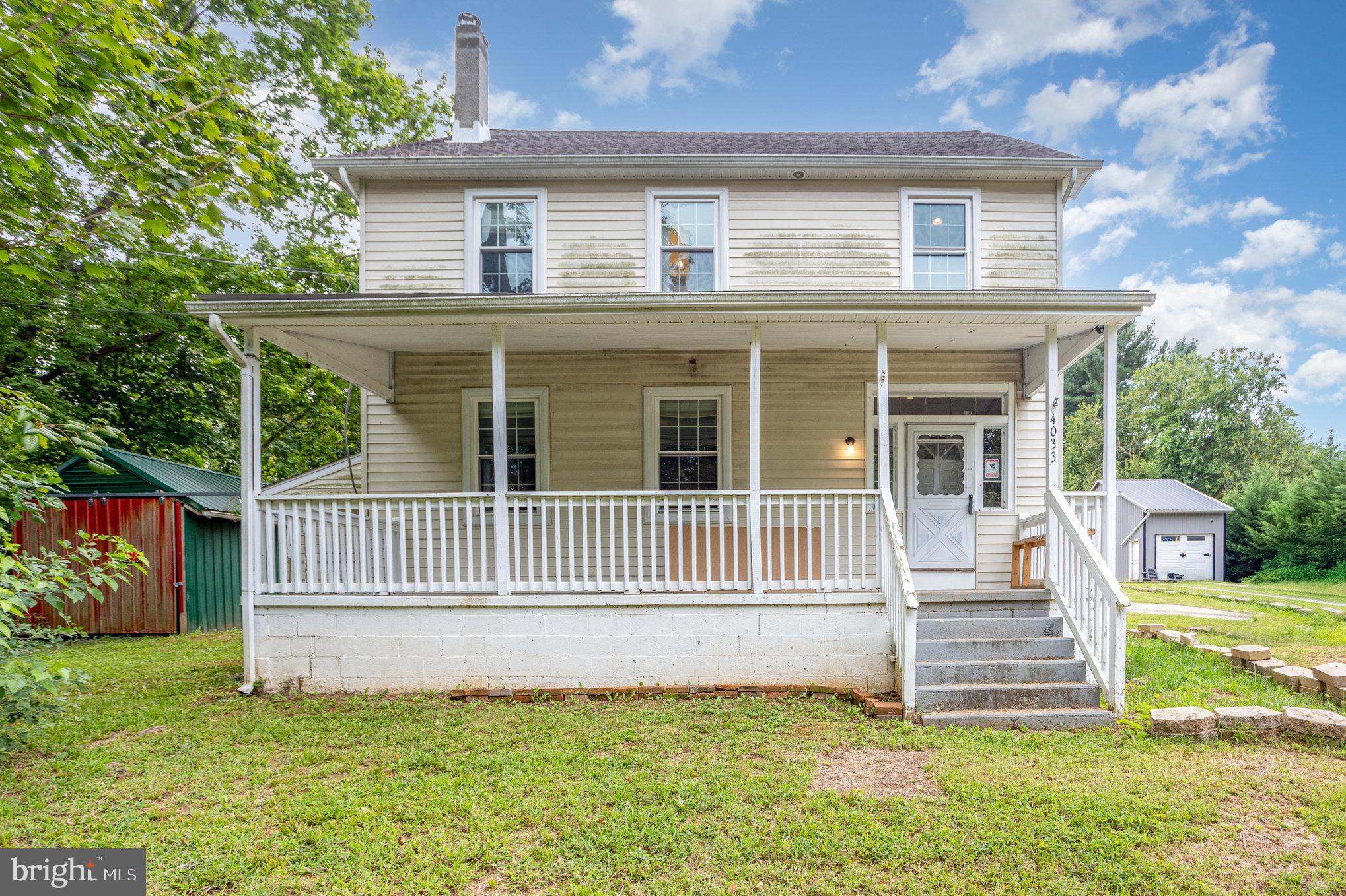 4033 Conowingo Road Darlington, MD 21034 - Photo 2 of 42 a front view of a house with a garden