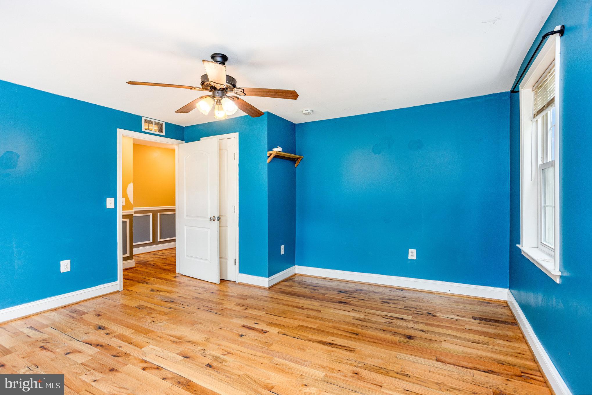 4033 Conowingo Road Darlington, MD 21034 - Photo 24 of 42 a view of a livingroom with wooden floor and a ceiling fan
