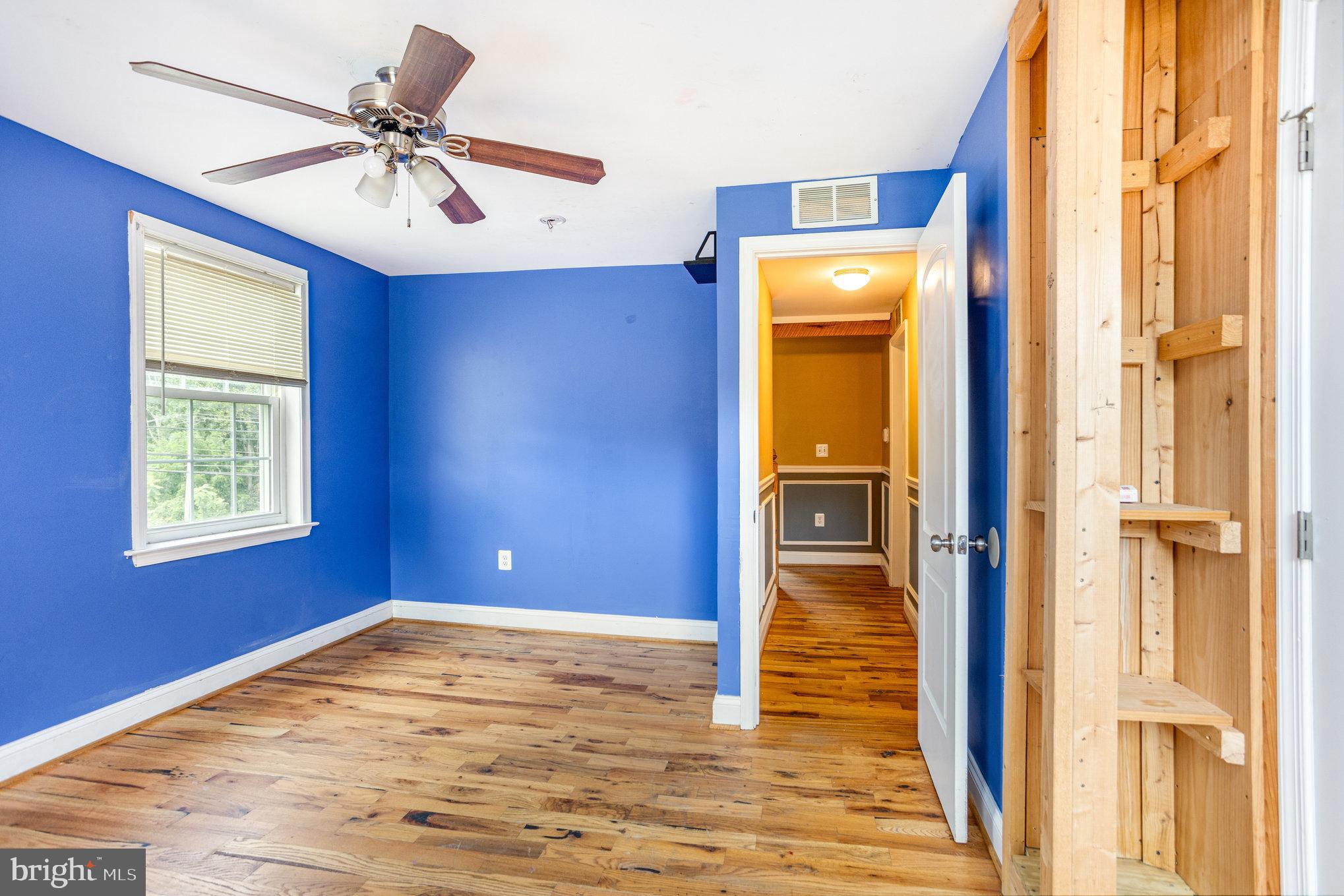 4033 Conowingo Road Darlington, MD 21034 - Photo 25 of 42 a view of livingroom with hardwood floor and a ceiling fan