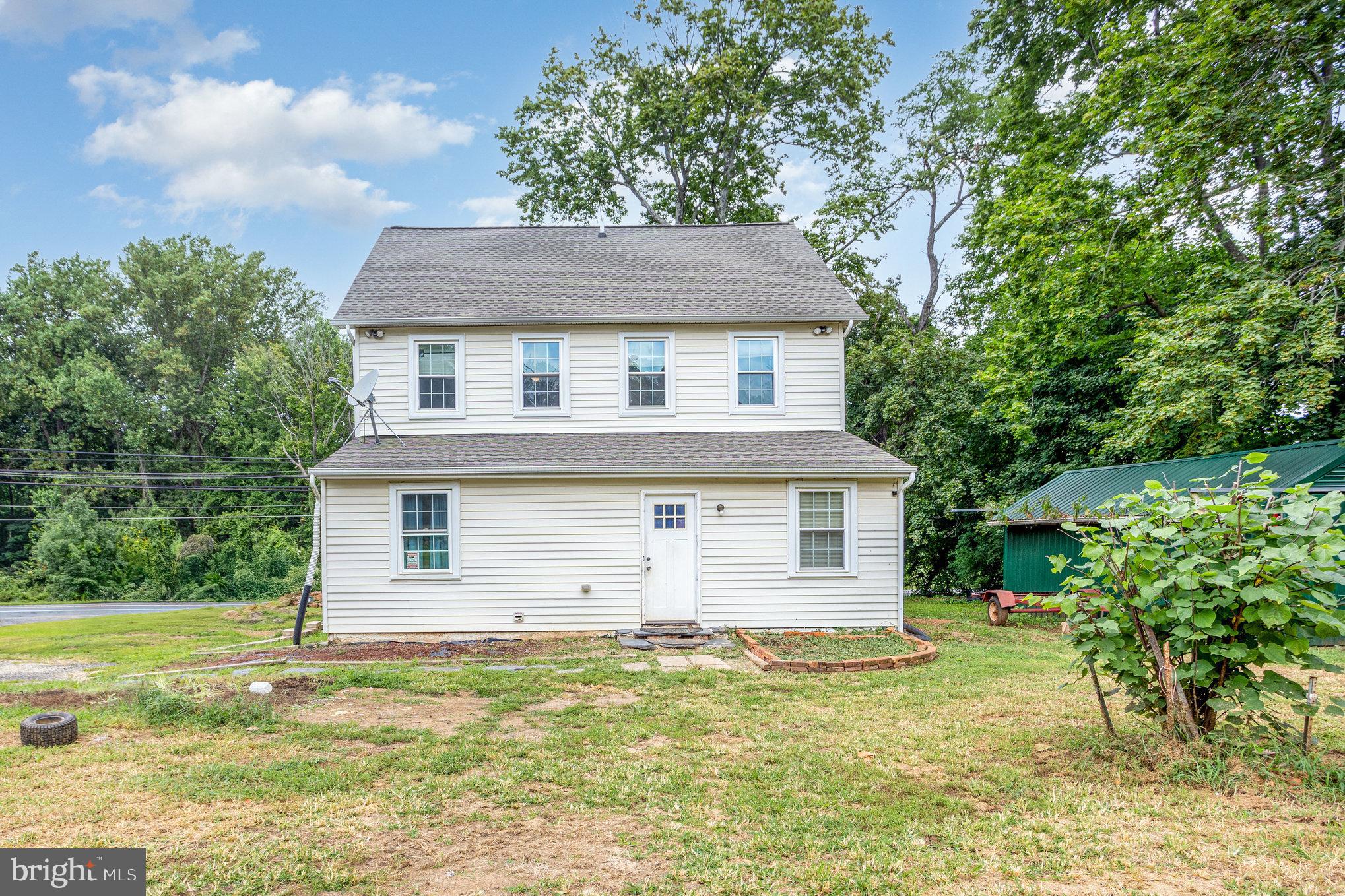 4033 Conowingo Road Darlington, MD 21034 - Photo 37 of 42 a front view of a house with a garden