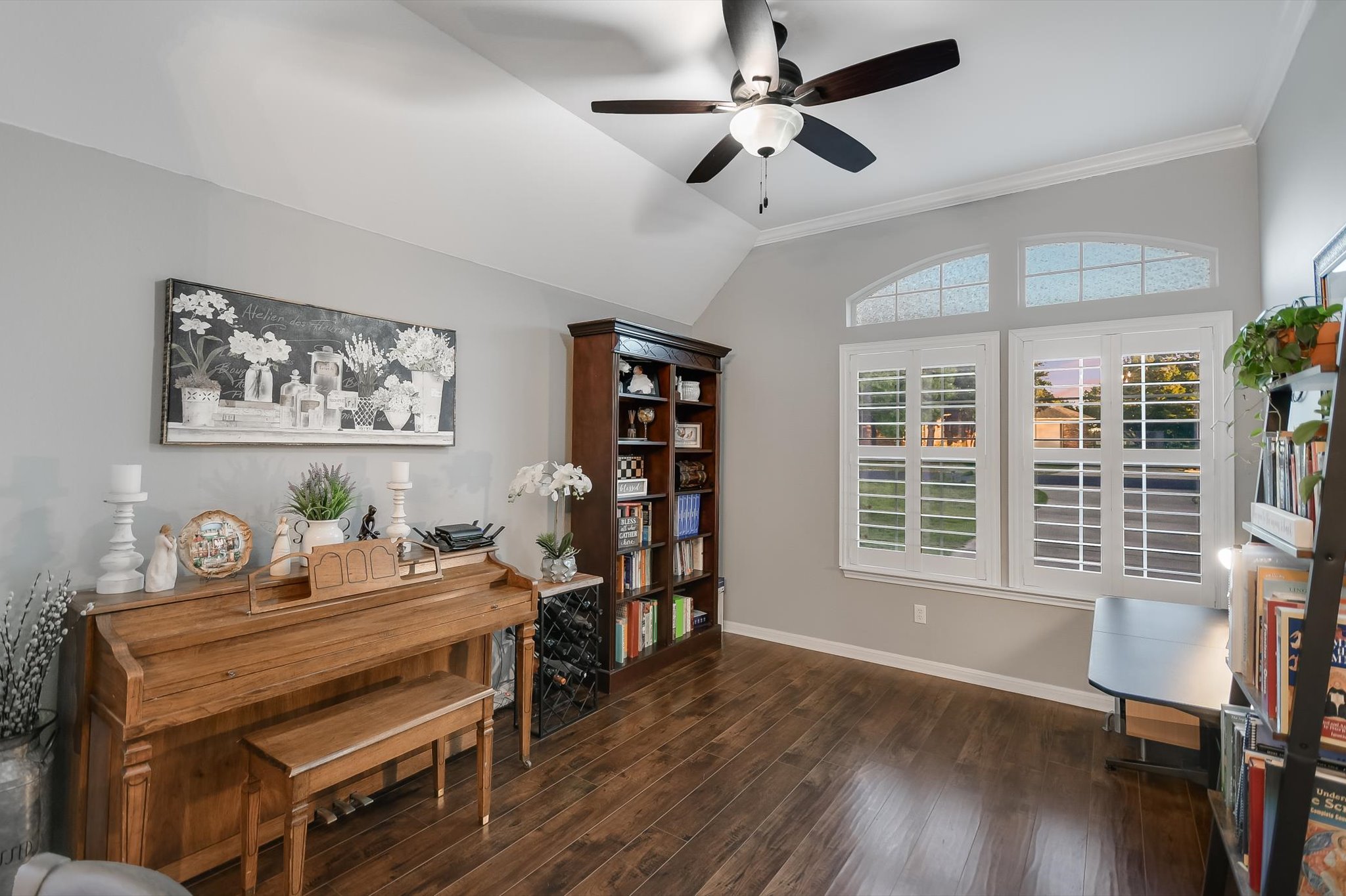 300 Wesley Ridge Drive Spicewood, TX 78669 - Photo 8 of 40 Located at the front of the home, this bonus living space offers cozy versatility with wood flooring, vaulted ceilings, and ample natural light—ideal for a reading nook, music room, or small home office.