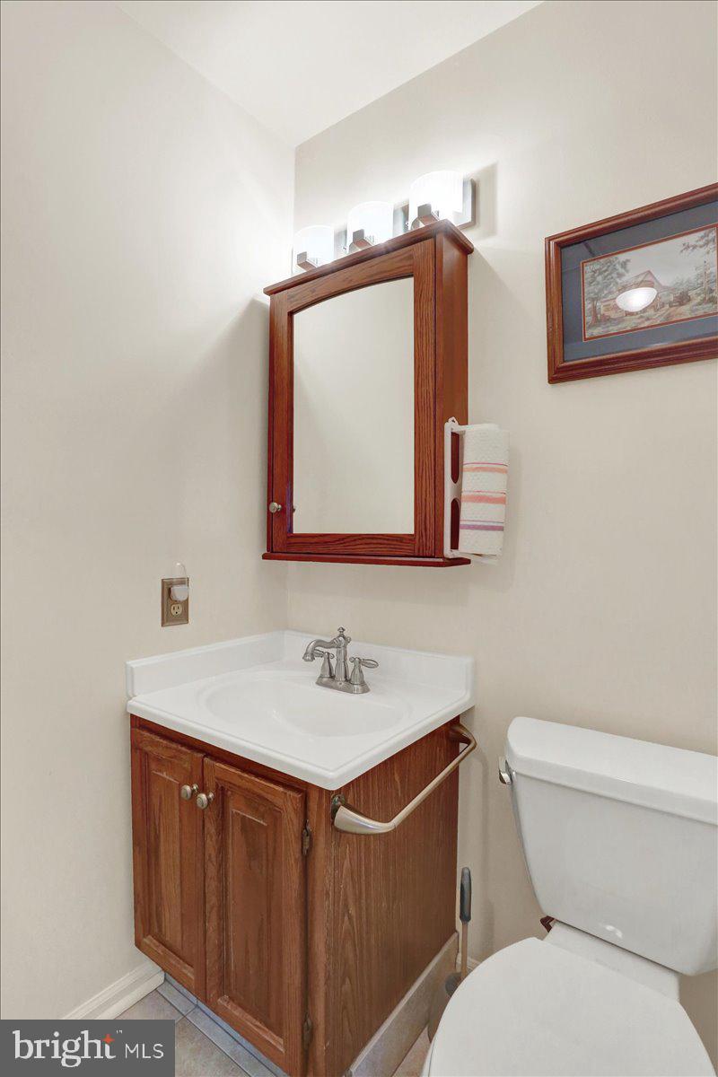 2127 Fairview Avenue Reading, PA 19606 - Photo 12 of 28 a bathroom with a toilet sink and mirror