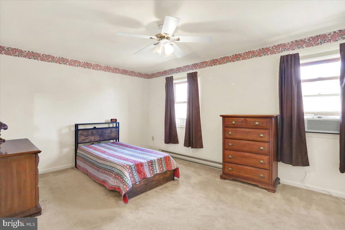 2127 Fairview Avenue Reading, PA 19606 - Photo 17 of 28 a bedroom with a bed and a ceiling fan