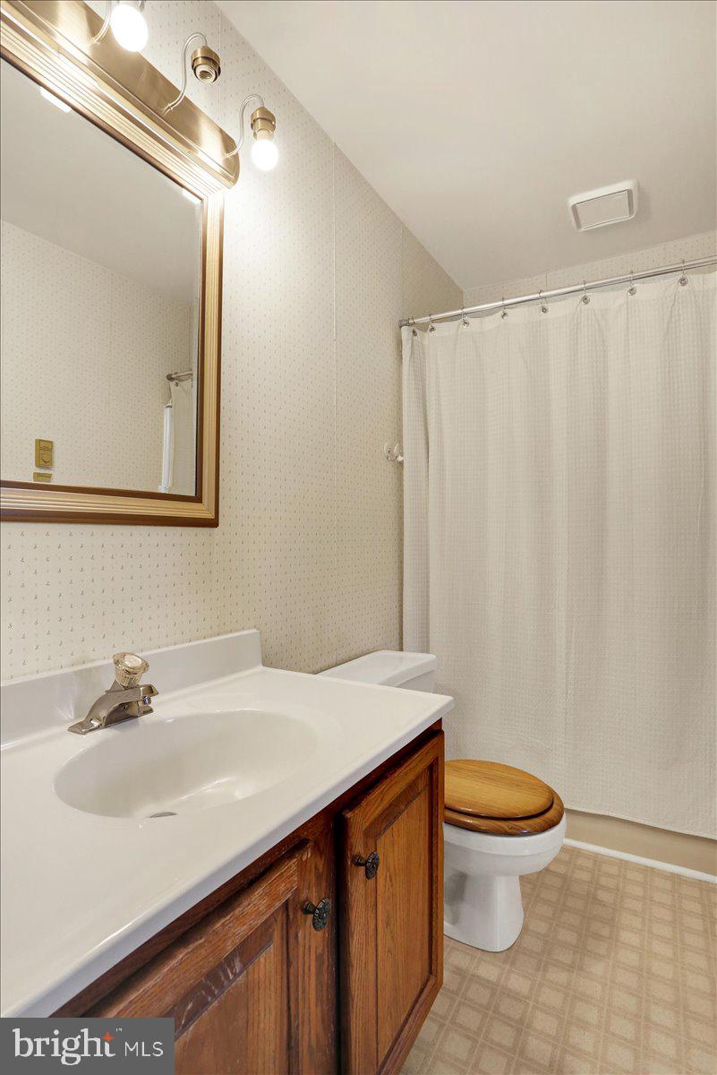 2127 Fairview Avenue Reading, PA 19606 - Photo 19 of 28 a bathroom with a sink a toilet and shower