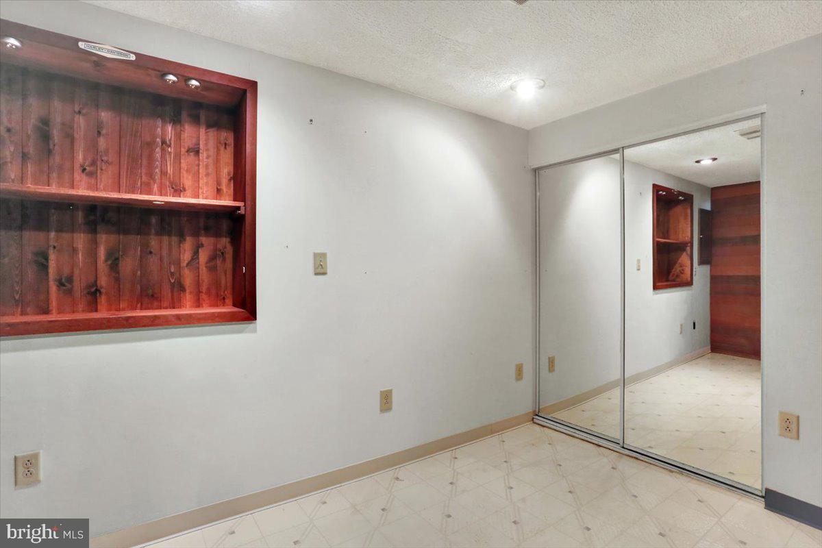 2127 Fairview Avenue Reading, PA 19606 - Photo 22 of 28 an empty room with wooden floor and windows