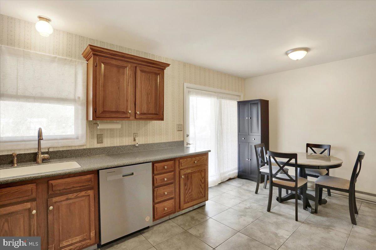 2127 Fairview Avenue Reading, PA 19606 - Photo 10 of 28 a kitchen with a sink and chairs