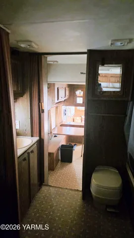 a bathroom with a toilet a sink and a vanity