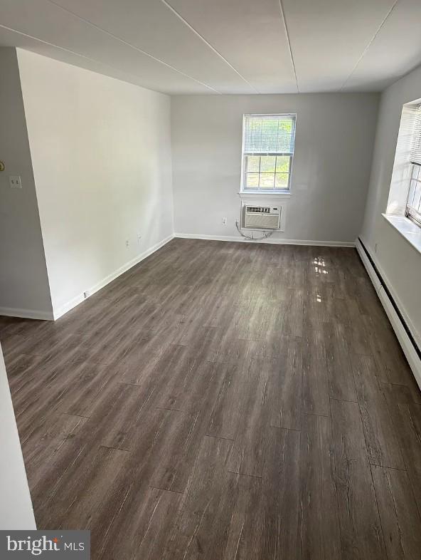 37 East Montgomery Avenue, Unit 2 Ardmore, PA 19003 - Photo 4 of 11 an empty room with wooden floor and windows