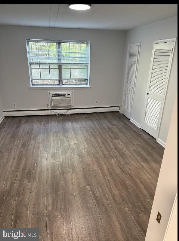 37 East Montgomery Avenue, Unit 2 Ardmore, PA 19003 - Photo 10 of 11 an empty room with wooden floor and windows