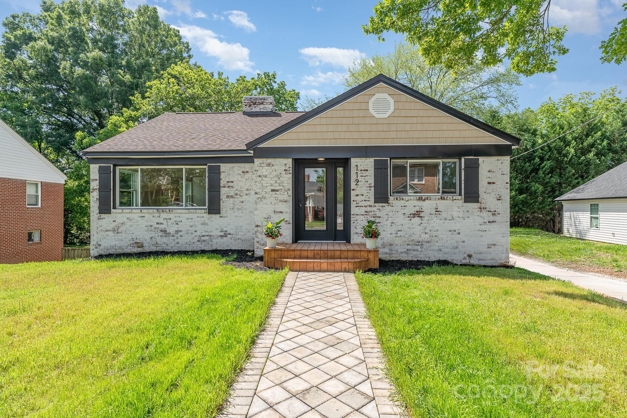 112 Circle Drive Salisbury, NC 28144 - Photo 14 of 34 a front view of house with yard and trees in the background