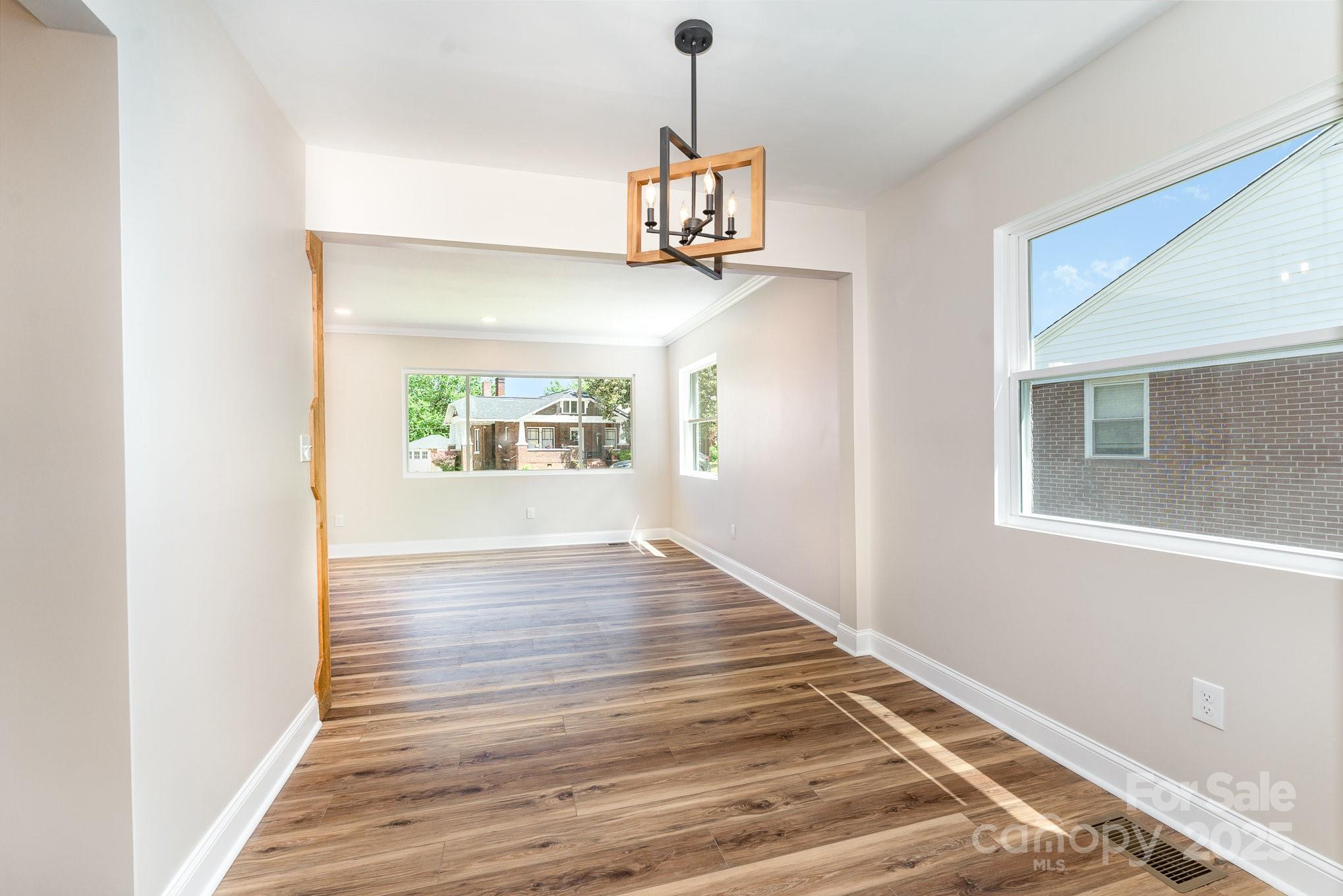 112 Circle Drive Salisbury, NC 28144 - Photo 15 of 34 a view of an empty room with wooden floor and a window