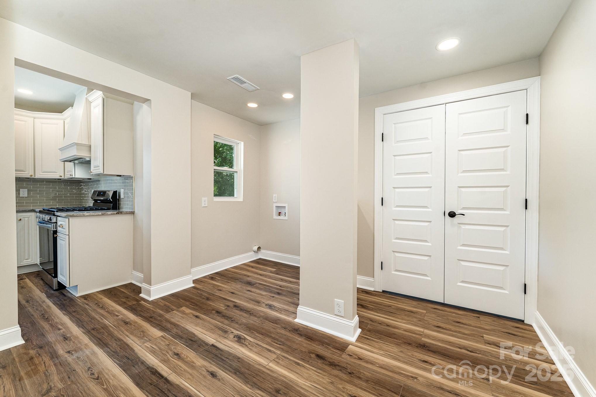 112 Circle Drive Salisbury, NC 28144 - Photo 17 of 34 an empty room with wooden floor cabinet and windows