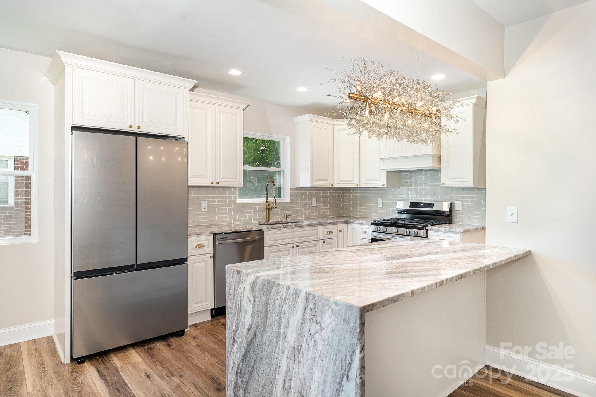 112 Circle Drive Salisbury, NC 28144 - Photo 2 of 34 a kitchen with a refrigerator a stove a sink and a microwave