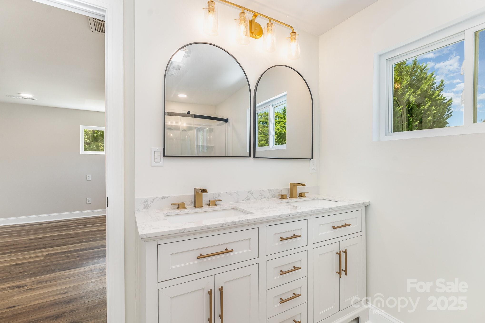 112 Circle Drive Salisbury, NC 28144 - Photo 23 of 34 a bathroom with a double vanity sink and a window