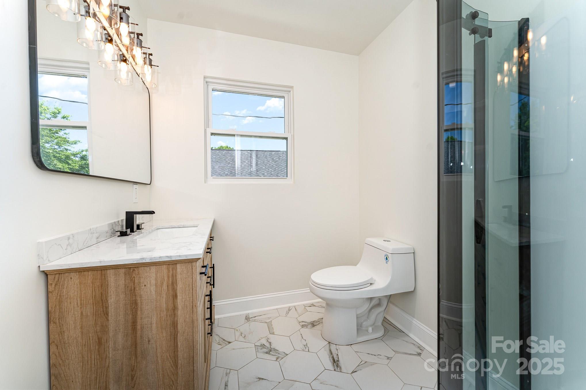 112 Circle Drive Salisbury, NC 28144 - Photo 28 of 34 a bathroom with a granite countertop sink a toilet and a mirror