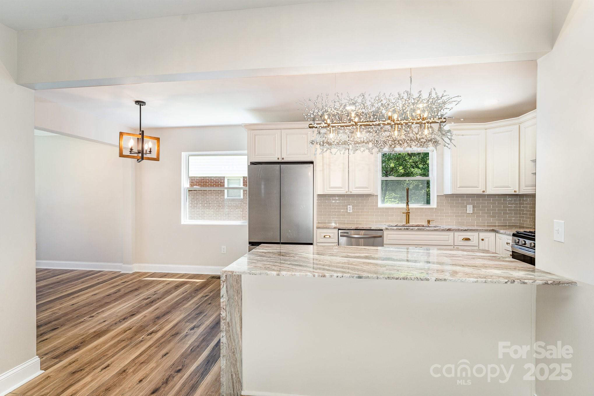 112 Circle Drive Salisbury, NC 28144 - Photo 3 of 34 a kitchen with kitchen island a counter top space a sink stainless steel appliances and cabinets