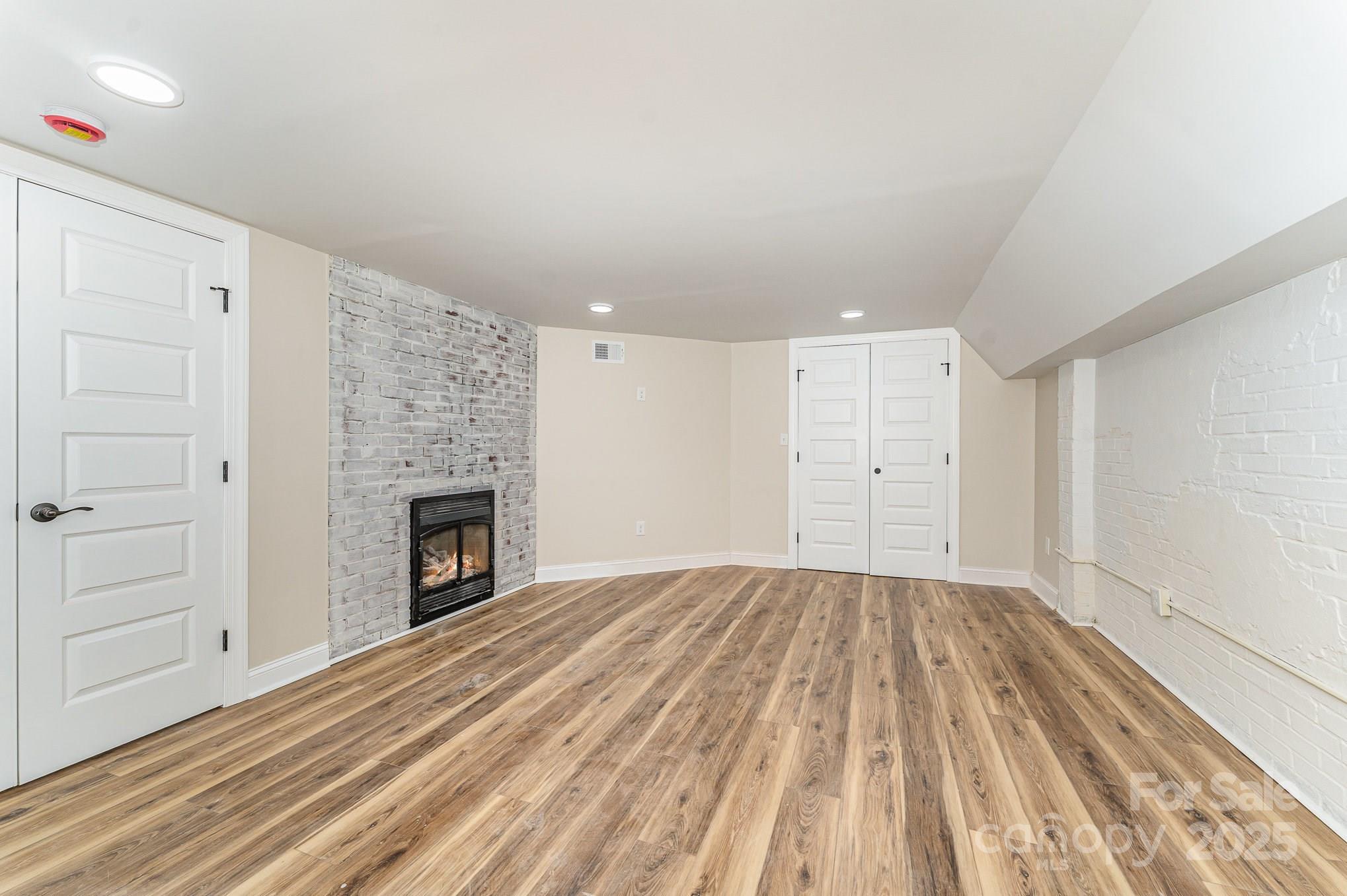 112 Circle Drive Salisbury, NC 28144 - Photo 31 of 34 a view of empty room with a fireplace and wooden floor