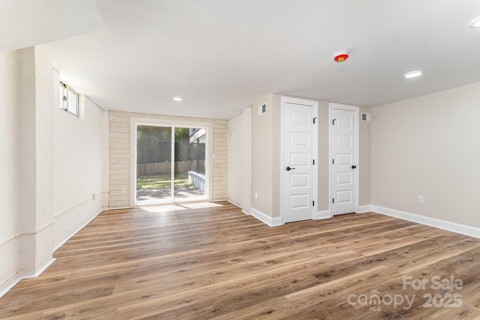 112 Circle Drive Salisbury, NC 28144 - Photo 32 of 34 a view of an empty room with wooden floor and a window