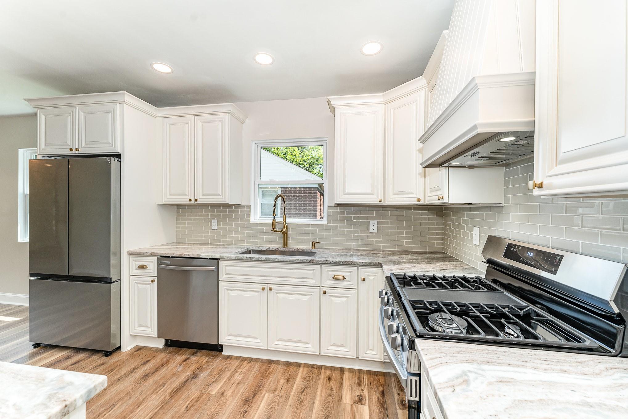 112 Circle Drive Salisbury, NC 28144 - Photo 4 of 34 a kitchen with white cabinets and appliances
