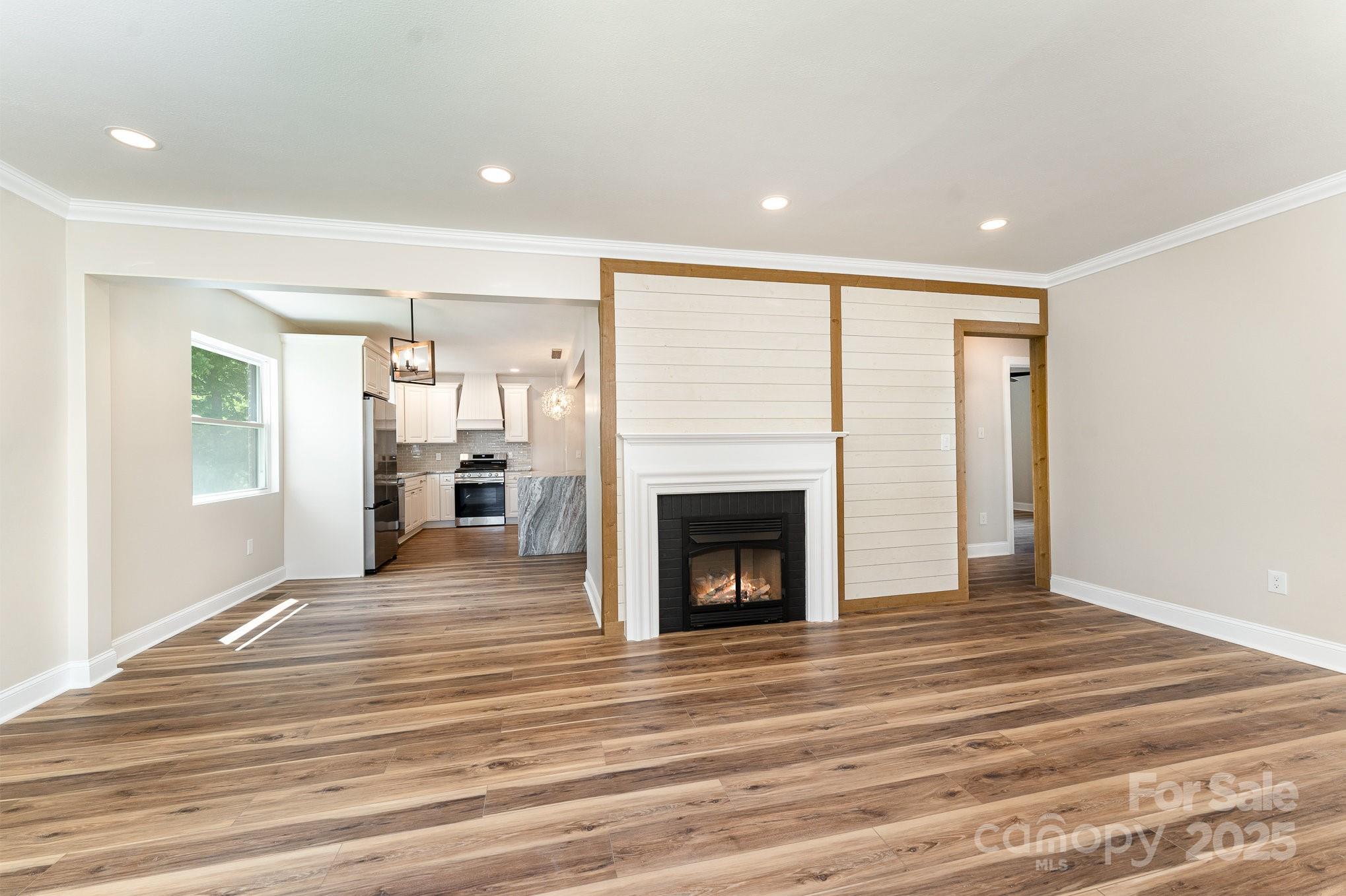 112 Circle Drive Salisbury, NC 28144 - Photo 8 of 34 a view of a livingroom with wooden floor and a fireplace