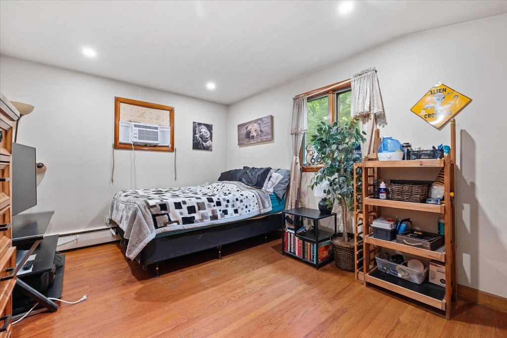 709 North Orange Road Athol, MA 01331 - Photo 25 of 40 a bedroom with furniture and a book shelf