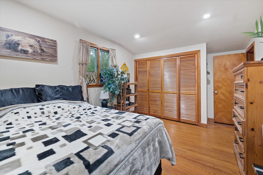 709 North Orange Road Athol, MA 01331 - Photo 26 of 40 a bedroom with a bed and wooden floor