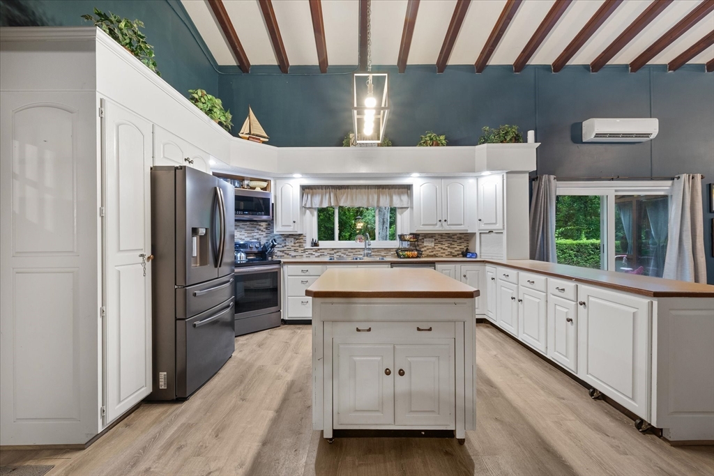 709 North Orange Road Athol, MA 01331 - Photo 7 of 40 a kitchen with white cabinets and stainless steel appliances