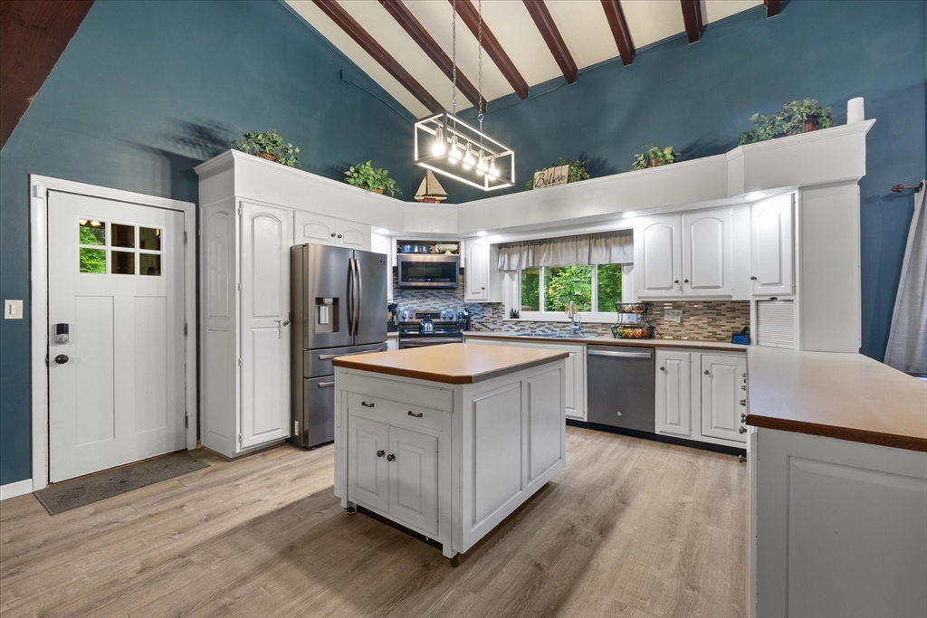 709 North Orange Road Athol, MA 01331 - Photo 8 of 40 a kitchen with a stove a sink and a refrigerator