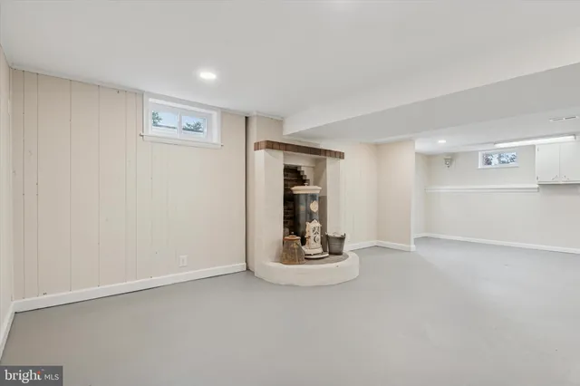 a view of an empty room with a fireplace