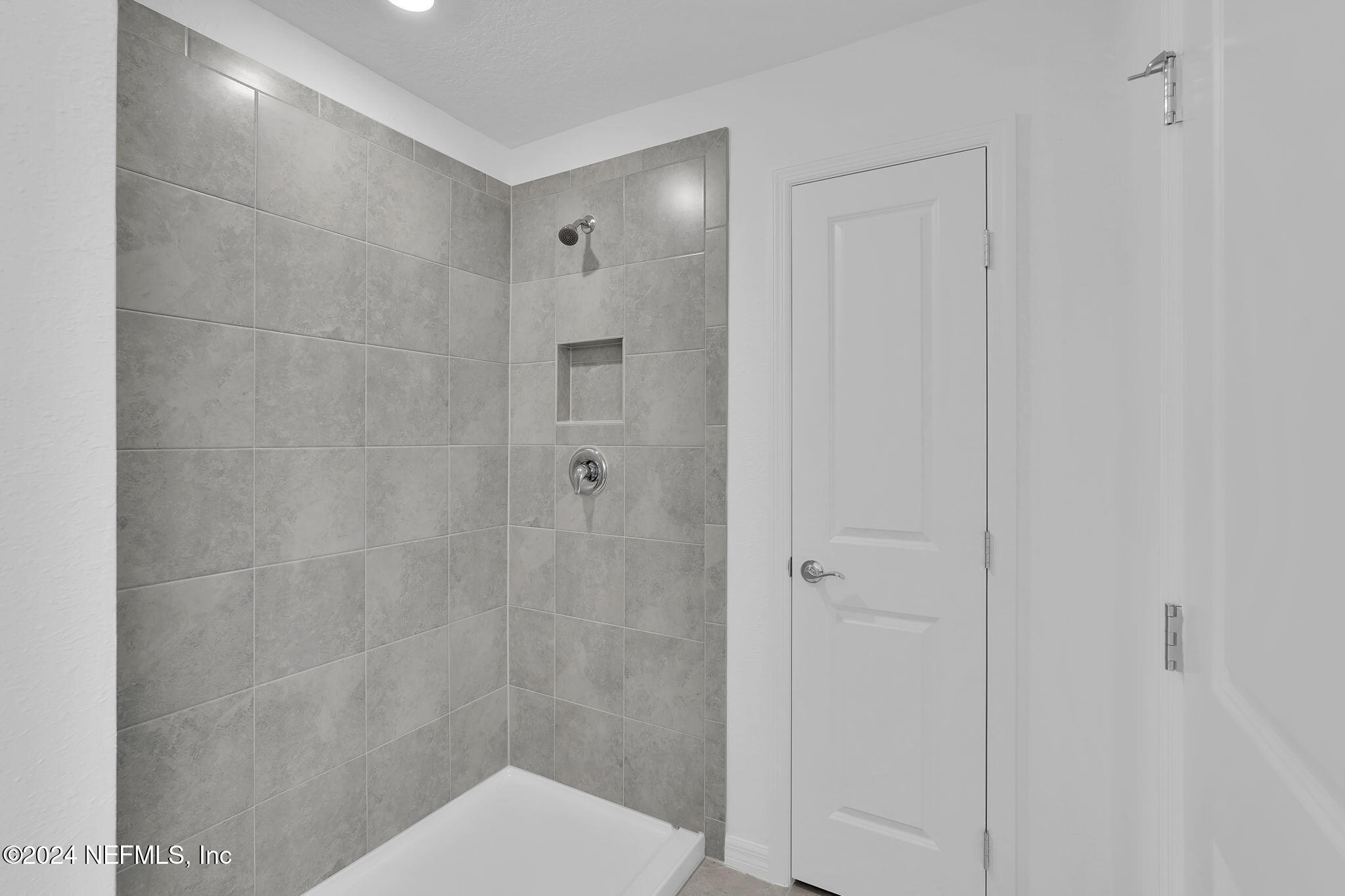 10121 Deep Pine Jacksonville, FL 32221 - Photo 18 of 24 a bathroom with a shower and a toilet