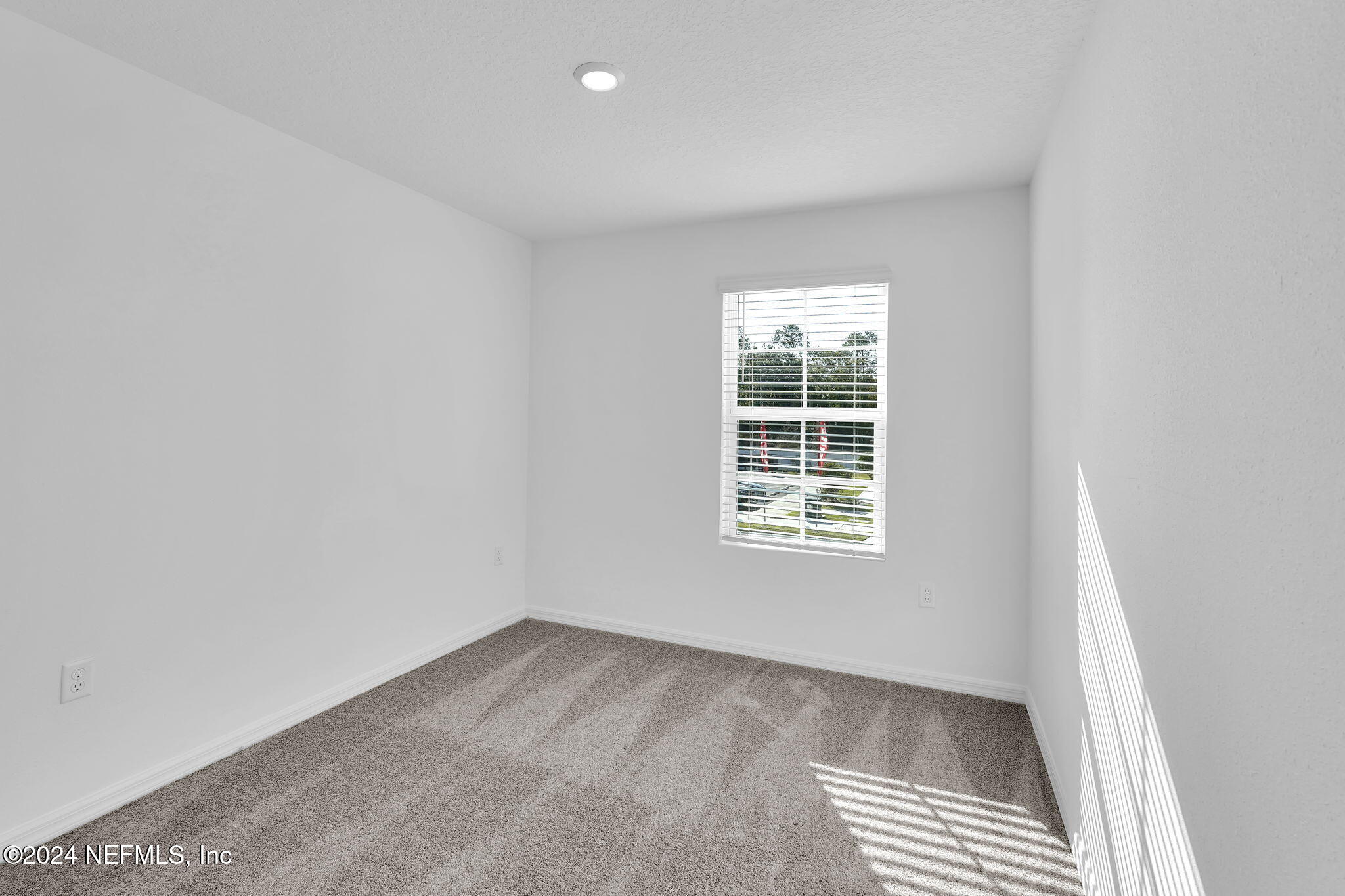 10121 Deep Pine Jacksonville, FL 32221 - Photo 22 of 24 an empty room with a window