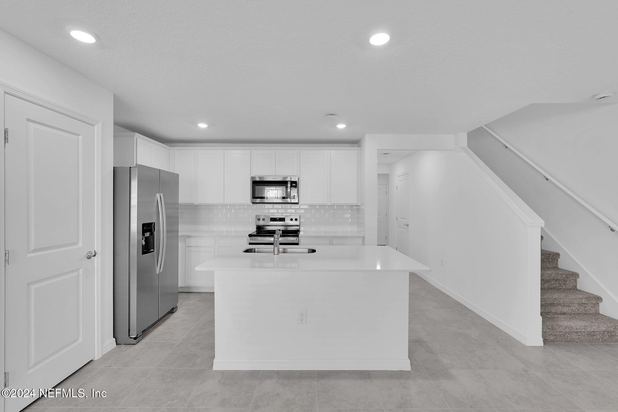 10121 Deep Pine Jacksonville, FL 32221 - Photo 8 of 24 a view of kitchen with stainless steel appliances a refrigerator and a stove top oven