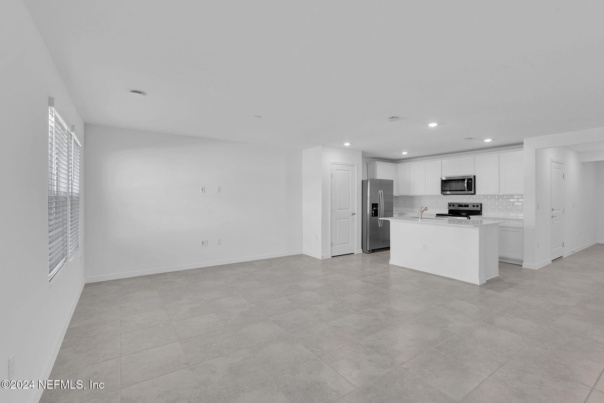 10121 Deep Pine Jacksonville, FL 32221 - Photo 10 of 24 a view of an empty room with kitchen