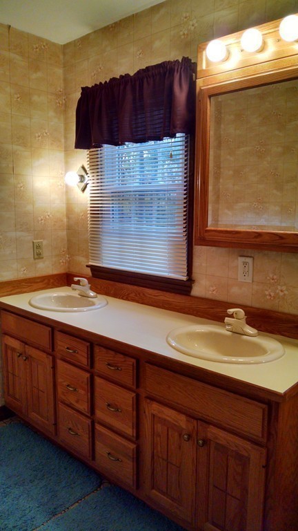 151 Hudson Road Stow, MA 01775 - Photo 11 of 17 a bathroom with a sink and a mirror