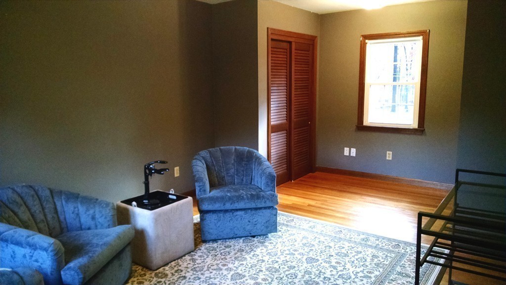 151 Hudson Road Stow, MA 01775 - Photo 12 of 17 a living room with furniture rug and wooden floor