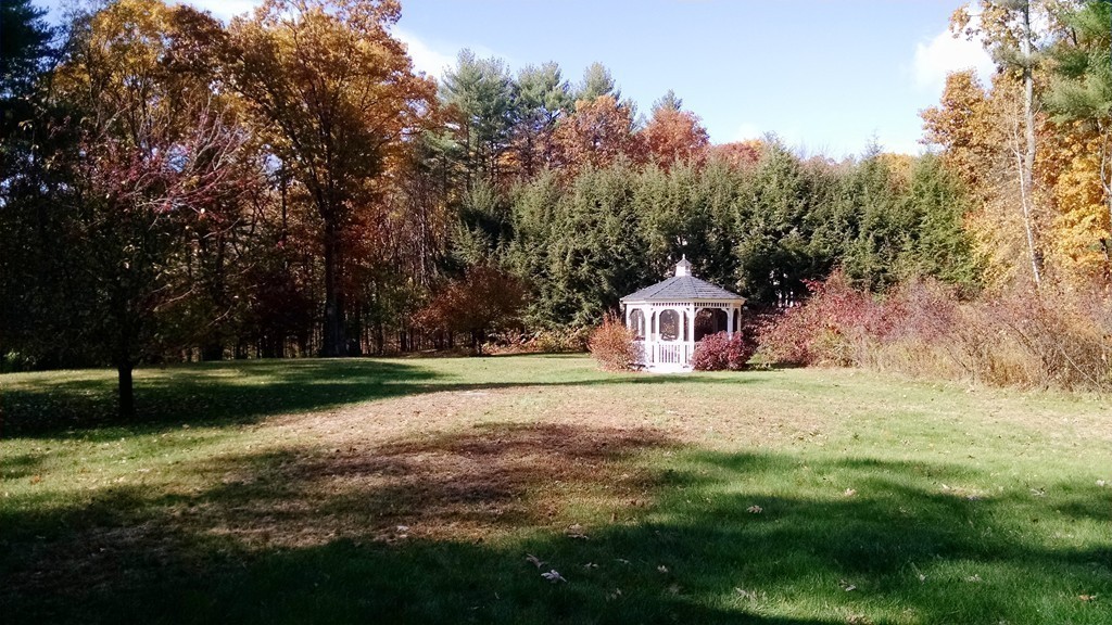 151 Hudson Road Stow, MA 01775 - Photo 16 of 17 a front view of a house with a yard and garage