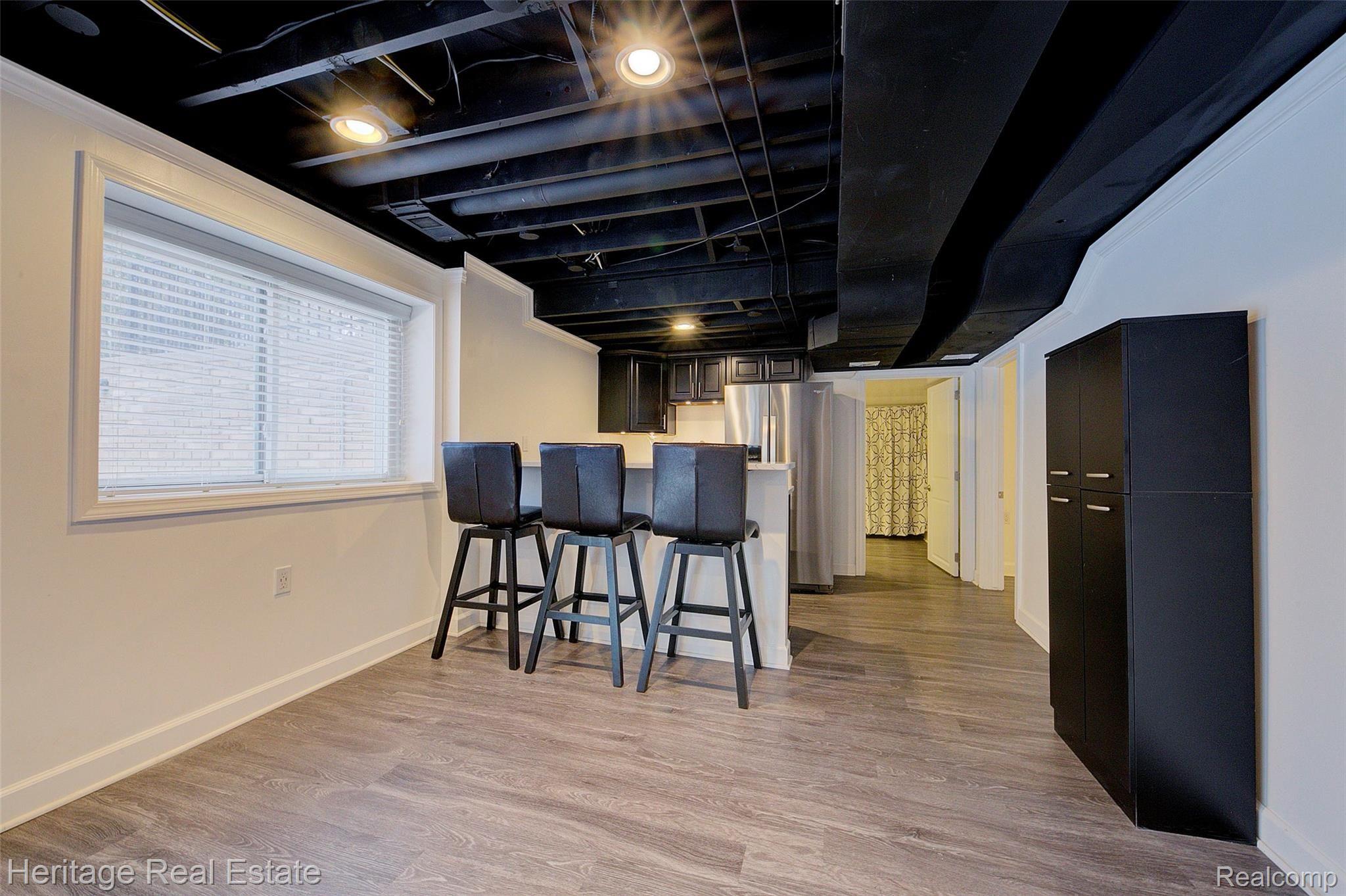 654 Old Perch Road Rochester, MI 48309 - Photo 46 of 61 Huge finished walk-out basement abounds with light and is perfect for fun, entertaining, and hosting over-night guests. Full kitchen has quartz counter tops and 2nd kitchen appliances are included.