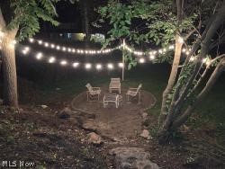 The spacious, private backyard is perfect for gathering around the firepit on a fall night or summer picnics.
