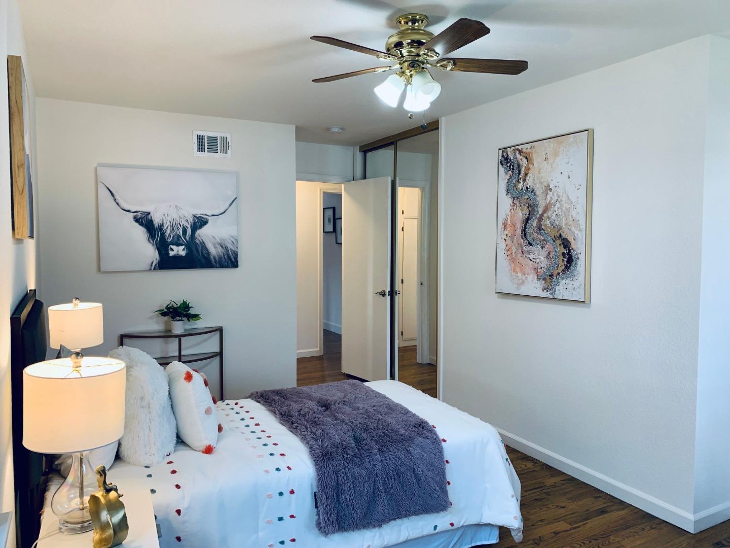 2432 Rinconada Drive San Jose, CA 95125 - Photo 15 of 33 a bedroom with a bed and wooden floor