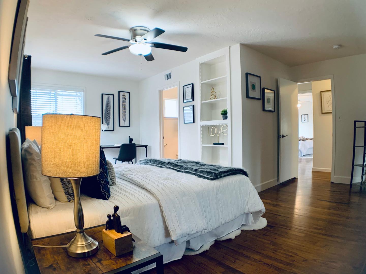2432 Rinconada Drive San Jose, CA 95125 - Photo 16 of 33 a bedroom with a bed and wooden floor