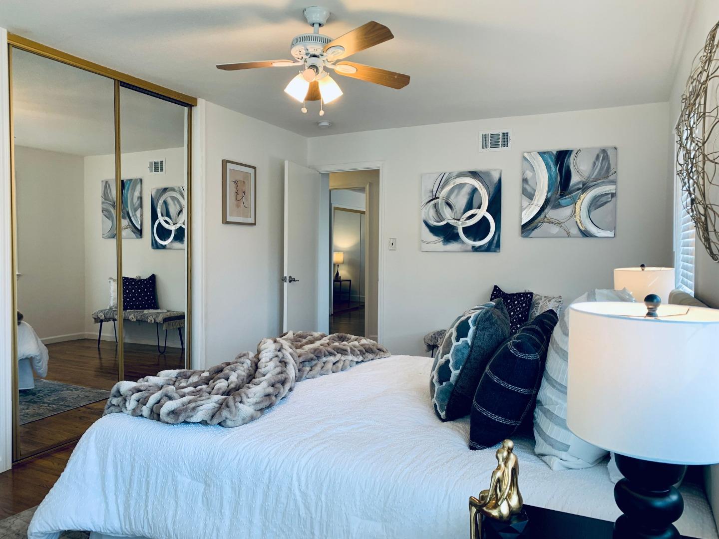 2432 Rinconada Drive San Jose, CA 95125 - Photo 18 of 33 a bedroom with a bed and a chandelier