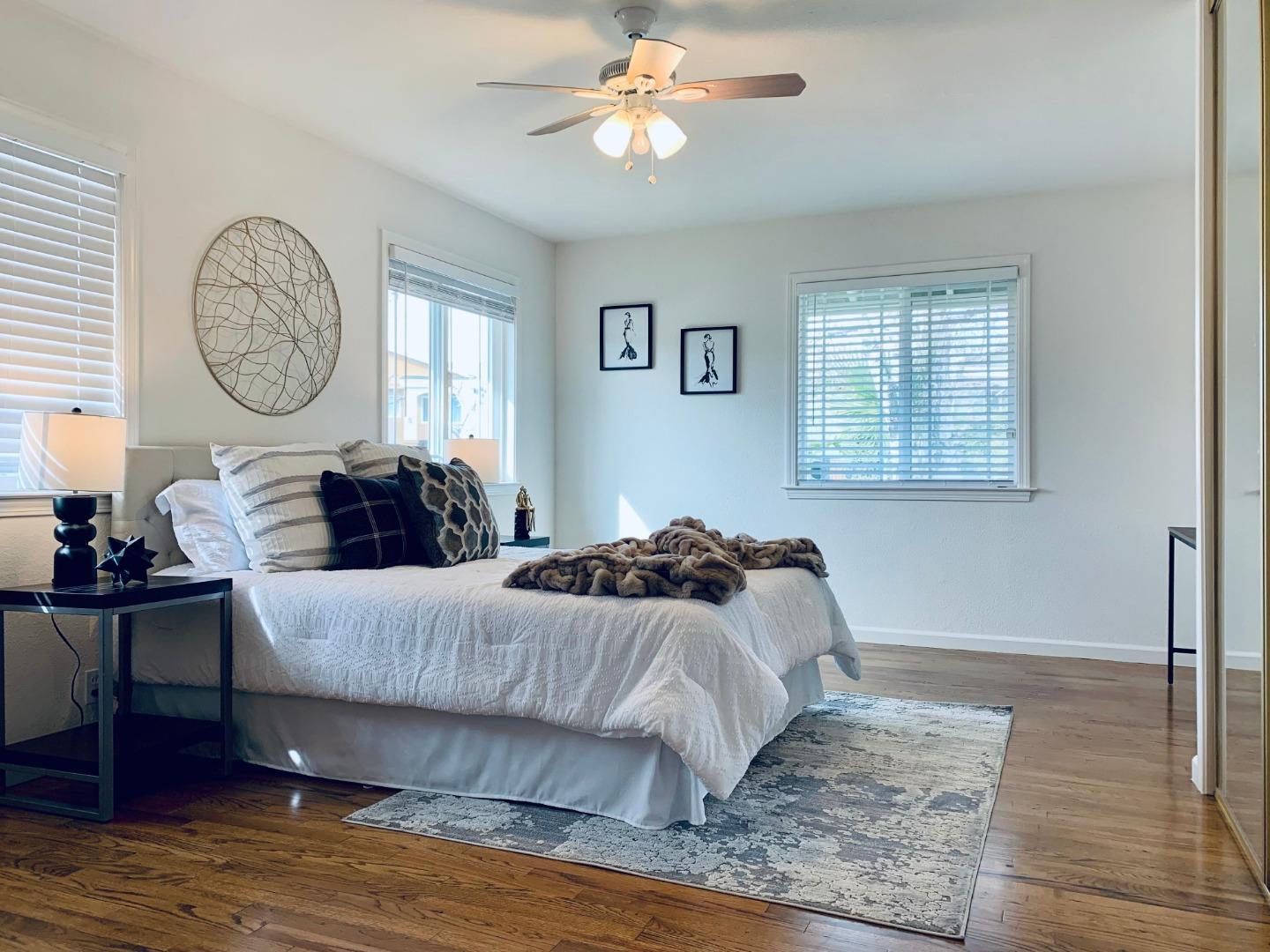 2432 Rinconada Drive San Jose, CA 95125 - Photo 21 of 33 a bedroom with a bed and wooden floor
