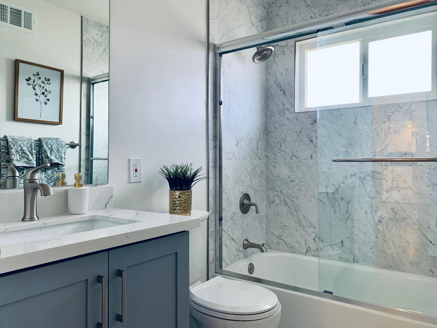 2432 Rinconada Drive San Jose, CA 95125 - Photo 23 of 33 a bathroom with a granite countertop sink toilet and shower