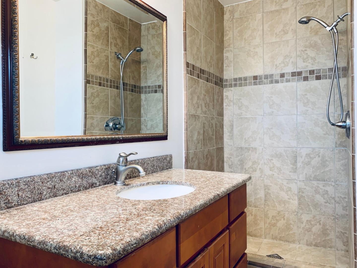 2432 Rinconada Drive San Jose, CA 95125 - Photo 25 of 33 a bathroom with a granite countertop sink and a mirror