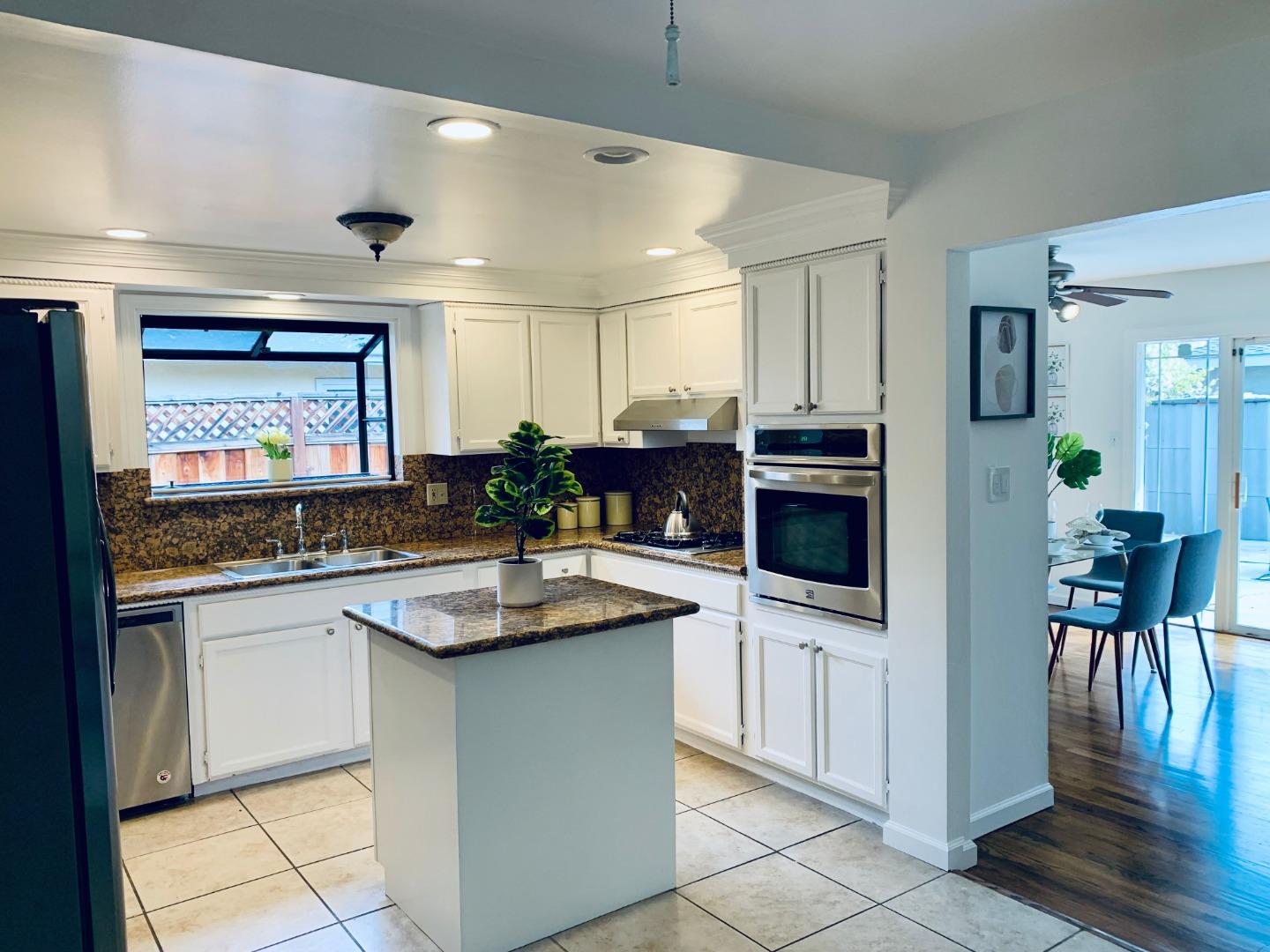2432 Rinconada Drive San Jose, CA 95125 - Photo 3 of 33 a kitchen with stainless steel appliances granite countertop a stove a sink and a refrigerator
