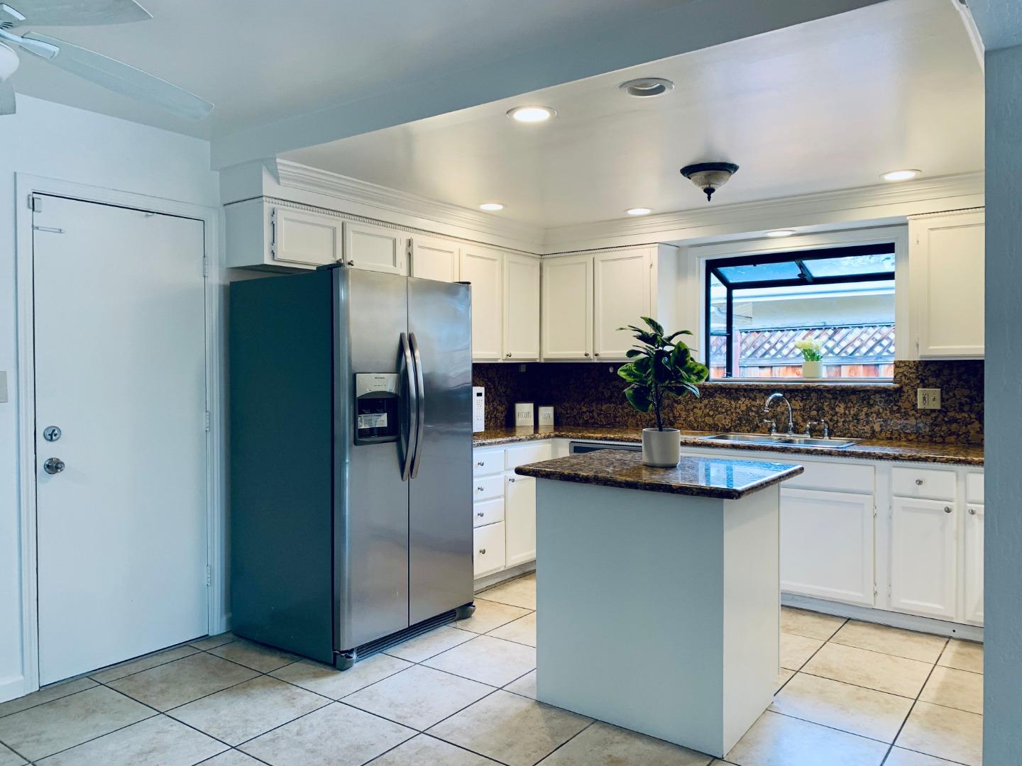2432 Rinconada Drive San Jose, CA 95125 - Photo 4 of 33 a kitchen with stainless steel appliances granite countertop a refrigerator and a sink